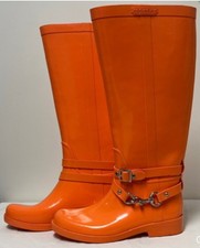 These are authentic Coach Lori tall rain boots in a bold orange color featuring Kadın Botları price