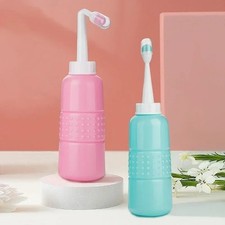 Pulverizador de bidé portátil de mano 500 ml a prueba de fugas ducha anal lavado ducha enema Bidet price
