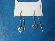 Zilverkleurige oorhangers met hartjes (nieuw) Zilver Oorbellen price