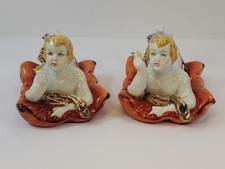Porcelain Babies On Pillows Holding Flowers With Gold Accents Baby Gold Pillow price